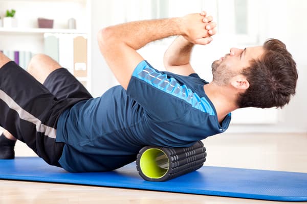 exercice d'assouplissement Foam Rolling